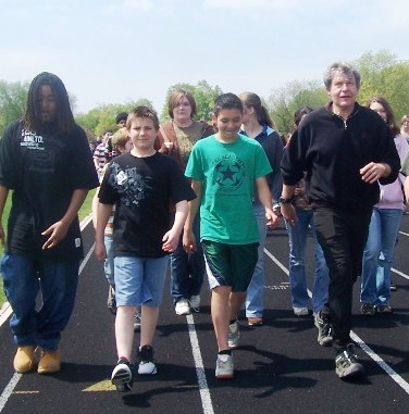 Plainfield students walking around a track